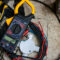 An electricians black and yellow clamp meter